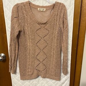 Dusty pink sweater with intricate design